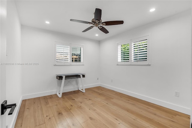 empty room with ceiling fan, light wood finished floors, recessed lighting, and baseboards