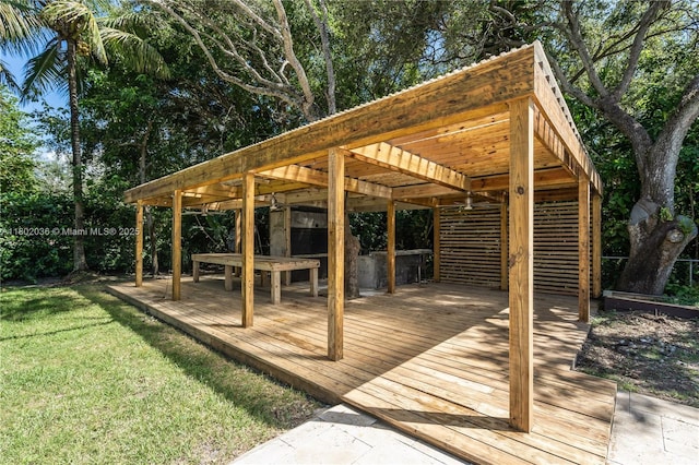 wooden deck with a pergola and a yard