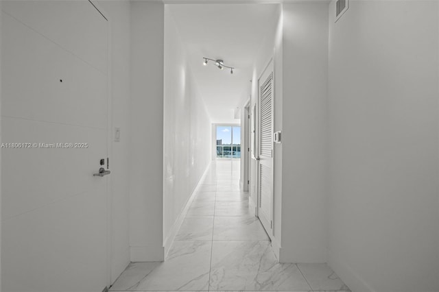 400 Sunny Isles Blvd Unit 1005, Sunny Isles Beach, FL 33160 - hallway with light marble finish flooring