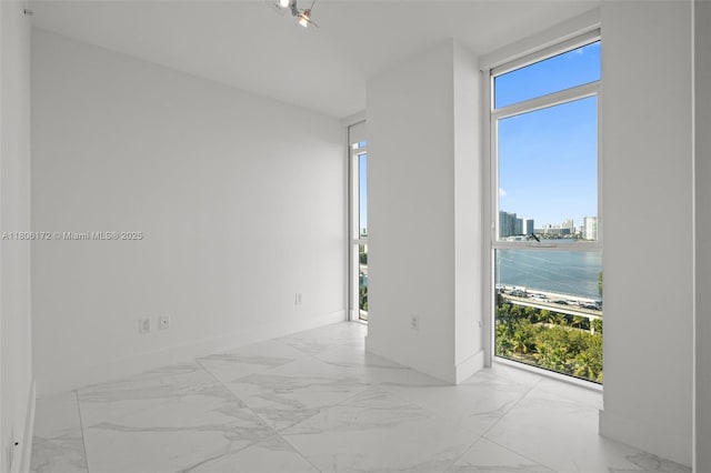 400 Sunny Isles Blvd Unit 1005, Sunny Isles Beach, FL 33160 - empty room featuring marble finish floors and a view of city