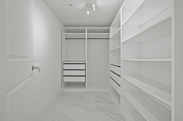 400 Sunny Isles Blvd Unit 1005, Sunny Isles Beach, FL 33160 - spacious closet featuring light marble finish flooring