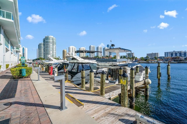 400 Sunny Isles Blvd Unit 1005, Sunny Isles Beach, FL 33160 - dock with a skyline view, a water view, and boat lift