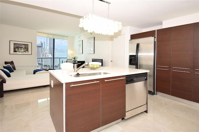 1900 N Bayshore Dr Unit 2804, Miami, FL 33132 - kitchen featuring stainless steel appliances, floor to ceiling windows, open floor plan, light countertops, and modern cabinets