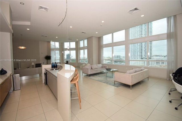 1900 N Bayshore Dr Unit 2804, Miami, FL 33132 - kitchen featuring open floor plan, a view of city, recessed lighting, light countertops, and a kitchen island