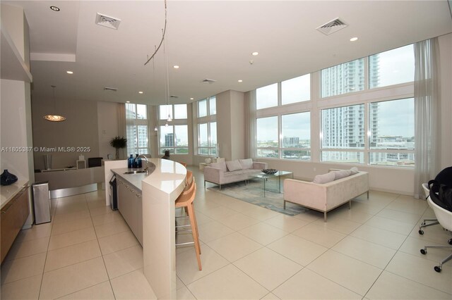 1900 N Bayshore Dr Unit 2804, Miami, FL 33132 - kitchen featuring open floor plan, a view of city, recessed lighting, light countertops, and a kitchen island