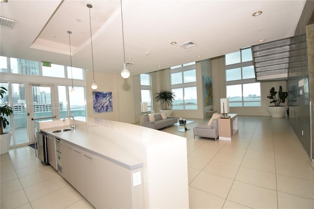 1900 N Bayshore Dr Unit 2804, Miami, FL 33132 - kitchen featuring light tile patterned floors, a center island with sink, decorative light fixtures, recessed lighting, and open floor plan