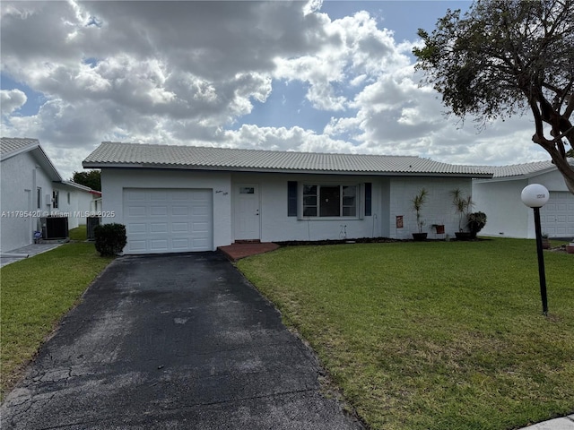 1250 NW 85th Ave, Plantation, FL 33322 - single story home with a garage, asphalt driveway, and a front lawn
