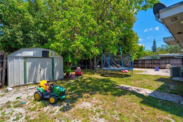 13645 NW 3rd Ave, North Miami, FL 33168 - view of yard featuring a trampoline, a shed, an outbuilding, and central AC unit