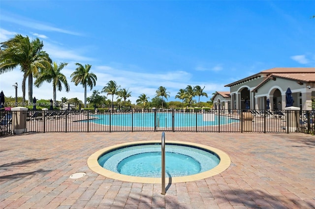 22780 SW 92nd Ct, Cutler Bay, FL 33190 - community pool with a community hot tub, fence, and a patio