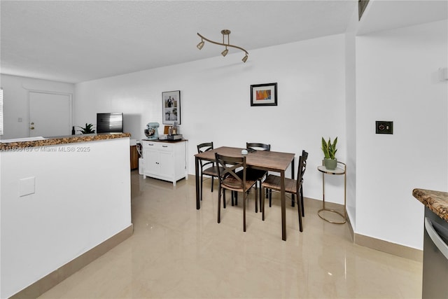 dining room with baseboards