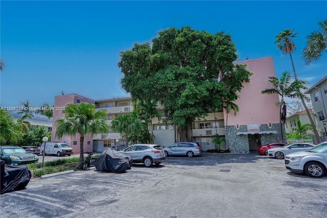 view of property featuring uncovered parking