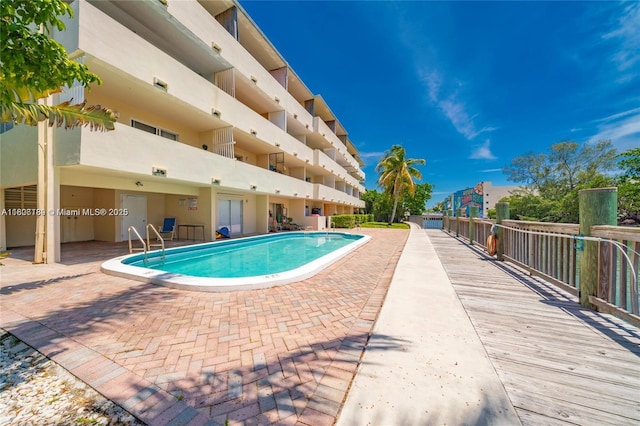 community pool featuring a patio