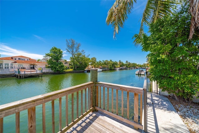 dock featuring a deck with water view