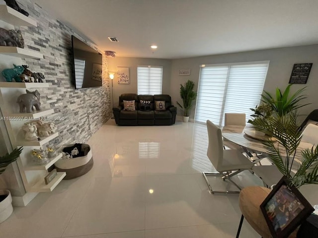living area with tile patterned flooring