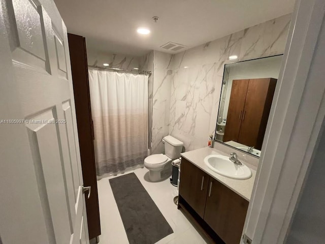 bathroom featuring vanity, toilet, curtained shower, tile walls, and recessed lighting
