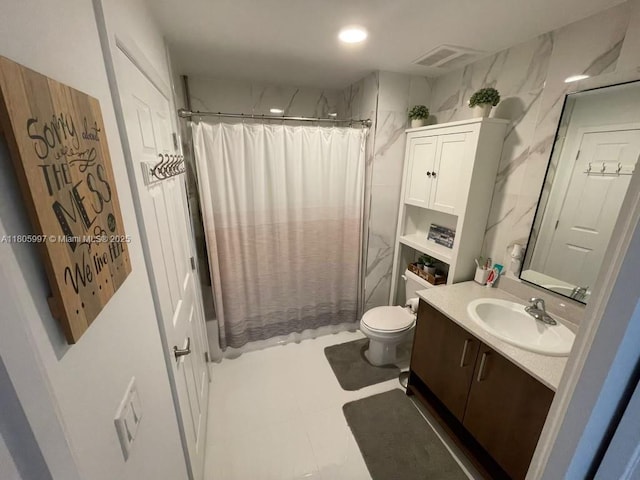 bathroom featuring vanity, a shower with curtain, and toilet