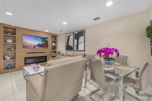 11429 NW 93rd Ct Unit 1, Hialeah Gardens, FL 33018 - living room with built in shelves, recessed lighting, a glass covered fireplace, and tile patterned flooring