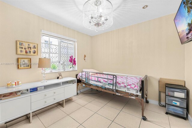 11429 NW 93rd Ct Unit 1, Hialeah Gardens, FL 33018 - bedroom with a chandelier and light tile patterned floors