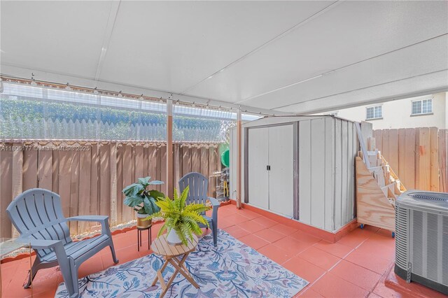 11429 NW 93rd Ct Unit 1, Hialeah Gardens, FL 33018 - fenced backyard featuring central AC unit and a patio