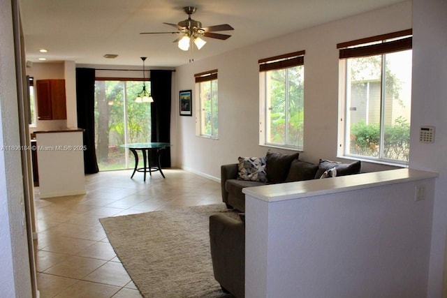 living room featuring light tile patterned floors, plenty of natural light, ceiling fan, and recessed lighting
