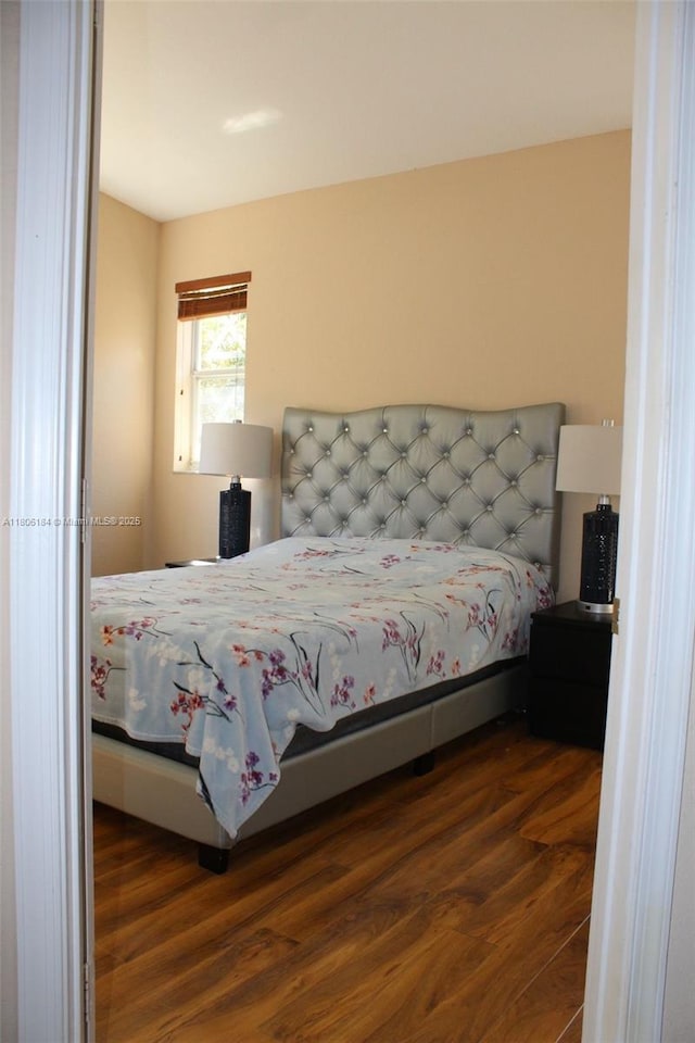 bedroom featuring wood finished floors