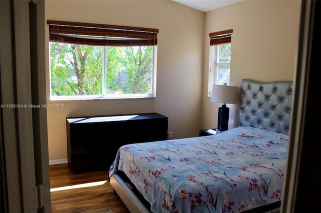bedroom with wood finished floors