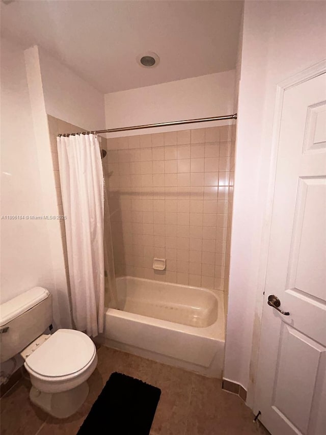 full bathroom featuring toilet, shower / bathtub combination with curtain, and tile patterned flooring