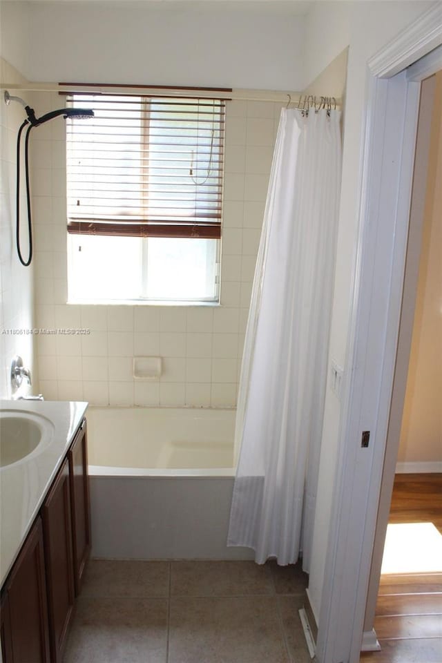 full bath with vanity, shower / bath combination with curtain, and tile patterned flooring