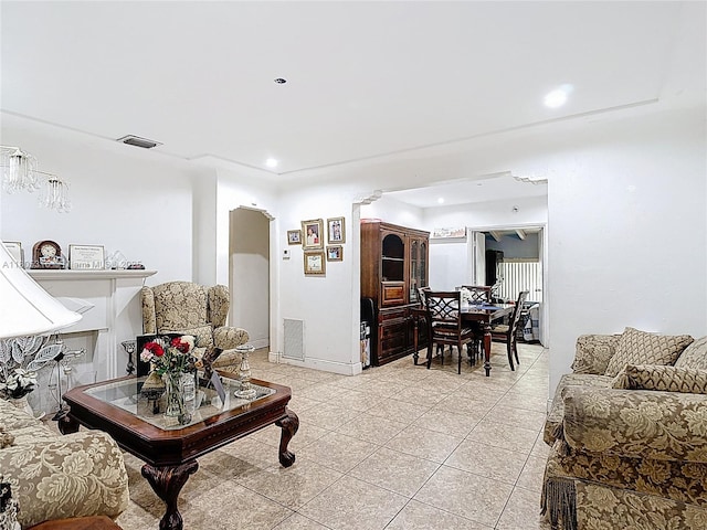 280 NW 45th St, Miami, FL 33127 - living room with light tile patterned floors, arched walkways, and recessed lighting