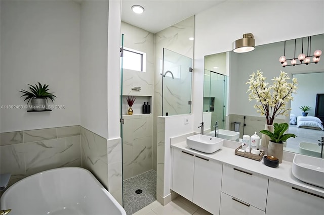 7006 Chain Ct, La Belle, FL 33935 - full bath with a soaking tub, a marble finish shower, and double vanity