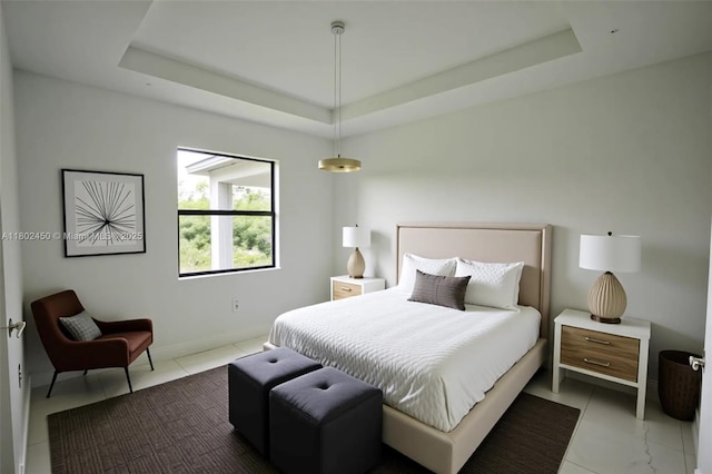 7006 Chain Ct, La Belle, FL 33935 - bedroom featuring a raised ceiling, tile patterned floors, and baseboards