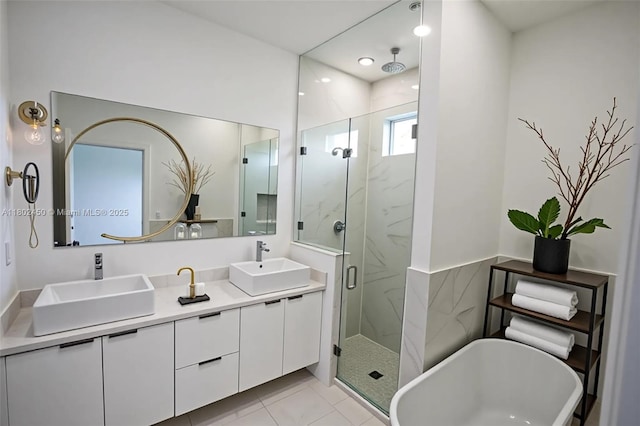 7006 Chain Ct, La Belle, FL 33935 - bathroom with a marble finish shower, double vanity, a soaking tub, and recessed lighting