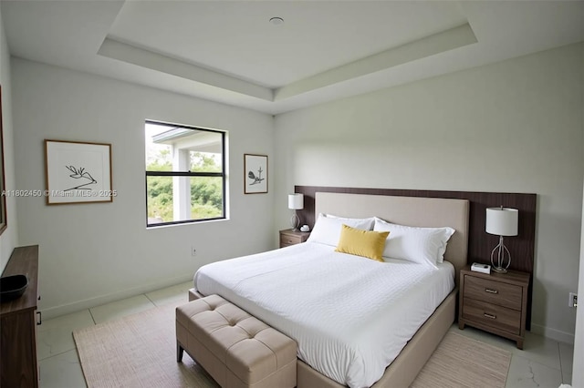 7006 Chain Ct, La Belle, FL 33935 - bedroom featuring a raised ceiling, baseboards, and light tile patterned floors