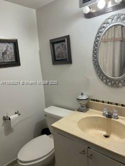 801 Three Islands Blvd Unit 112, Hallandale Beach, FL 33009 - bathroom featuring toilet and vanity