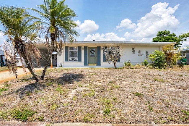 330 Lasayette Dr NE, Port Charlotte, FL 33952 - ranch-style house with a carport