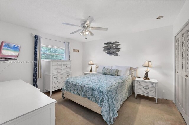 330 Lasayette Dr NE, Port Charlotte, FL 33952 - bedroom featuring a closet, light carpet, and ceiling fan