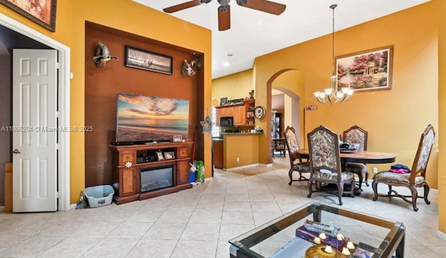 5764 NW 125th Ter, Coral Springs, FL 33076 - living room with arched walkways, a ceiling fan, light tile patterned floors, a chandelier, and baseboards
