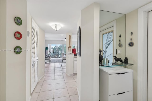 3050 NE 47th Ct Unit 205, Fort Lauderdale, FL 33308 - hall with light tile patterned flooring and baseboards