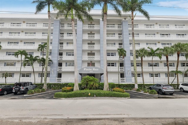 3050 NE 47th Ct Unit 205, Fort Lauderdale, FL 33308 - view of apartment building / complex with uncovered parking and fence