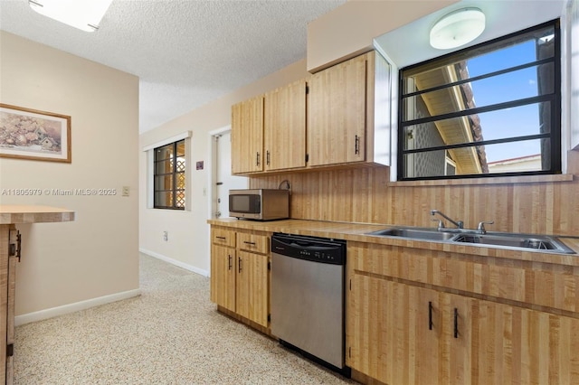4295 SW 97th Ct, Miami, FL 33165 - kitchen with appliances with stainless steel finishes, a sink, baseboards, light countertops, and light brown cabinets