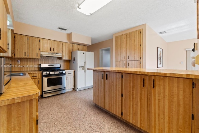 4295 SW 97th Ct, Miami, FL 33165 - kitchen featuring stainless steel gas range oven, white refrigerator with ice dispenser, under cabinet range hood, wood counters, and a textured ceiling