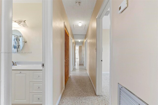 4295 SW 97th Ct, Miami, FL 33165 - corridor featuring baseboards and dark aggregate flooring