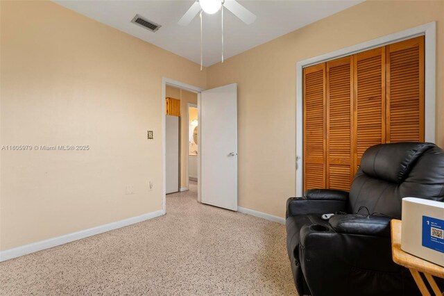 4295 SW 97th Ct, Miami, FL 33165 - living area featuring dark aggregate flooring, baseboards, and ceiling fan