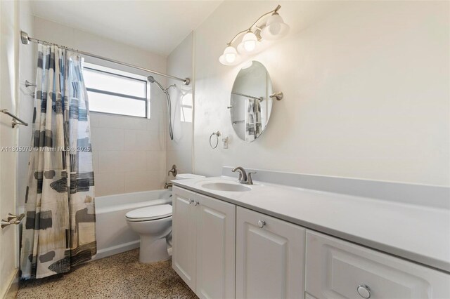 4295 SW 97th Ct, Miami, FL 33165 - bathroom featuring speckled floor, vanity, toilet, and shower / bath combo with shower curtain