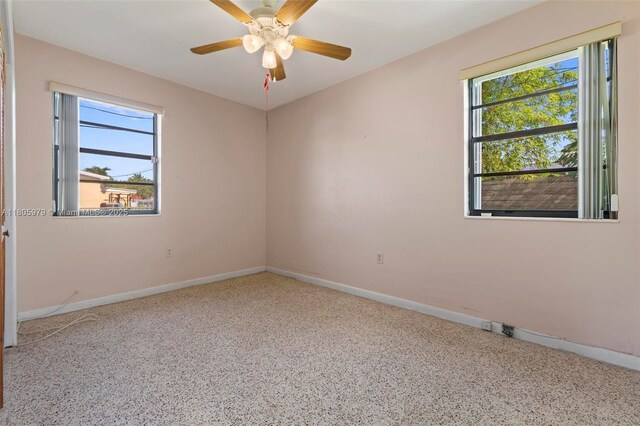 4295 SW 97th Ct, Miami, FL 33165 - unfurnished room featuring baseboards, a ceiling fan, and speckle patterned floor