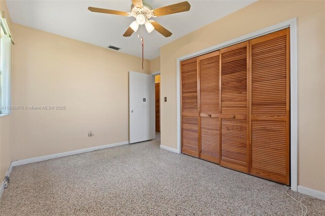 4295 SW 97th Ct, Miami, FL 33165 - unfurnished bedroom featuring baseboards, a closet, ceiling fan, and speckle patterned floor
