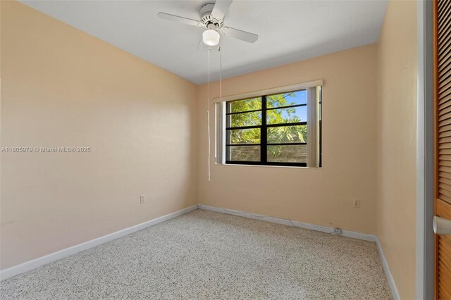 4295 SW 97th Ct, Miami, FL 33165 - spare room with baseboards, ceiling fan, and speckled floor
