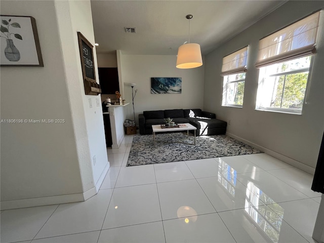 10012 NW 7th St Unit 203, Miami, FL 33172 - living room featuring baseboards and tile patterned flooring