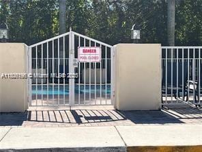 10012 NW 7th St Unit 203, Miami, FL 33172 - gate featuring fence