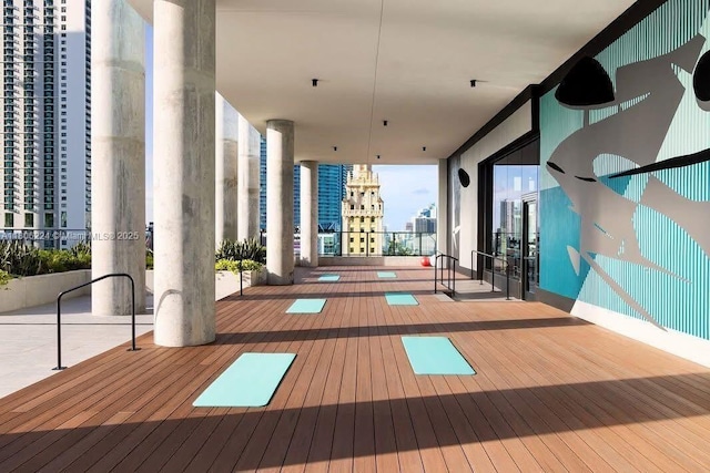 398 NE 5th St Unit 1619, Miami, FL 33132 - gym featuring wood-type flooring, a city view, and expansive windows
